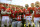 NEW BRUNSWICK, NJ - NOVEMBER 19:  Eric LeGrand #52 of the Rutgers Scarlet Knights posses for a photo with teammates on Senior's Day at center field before a game against Cincinnati Bearcats at Rutgers Stadium on November 19, 2011 in New Brunswick, New Jersey. LeGrand was paralyzed during a kickoff return in October 2010.  (Photo by Patrick McDermott/Getty Images)