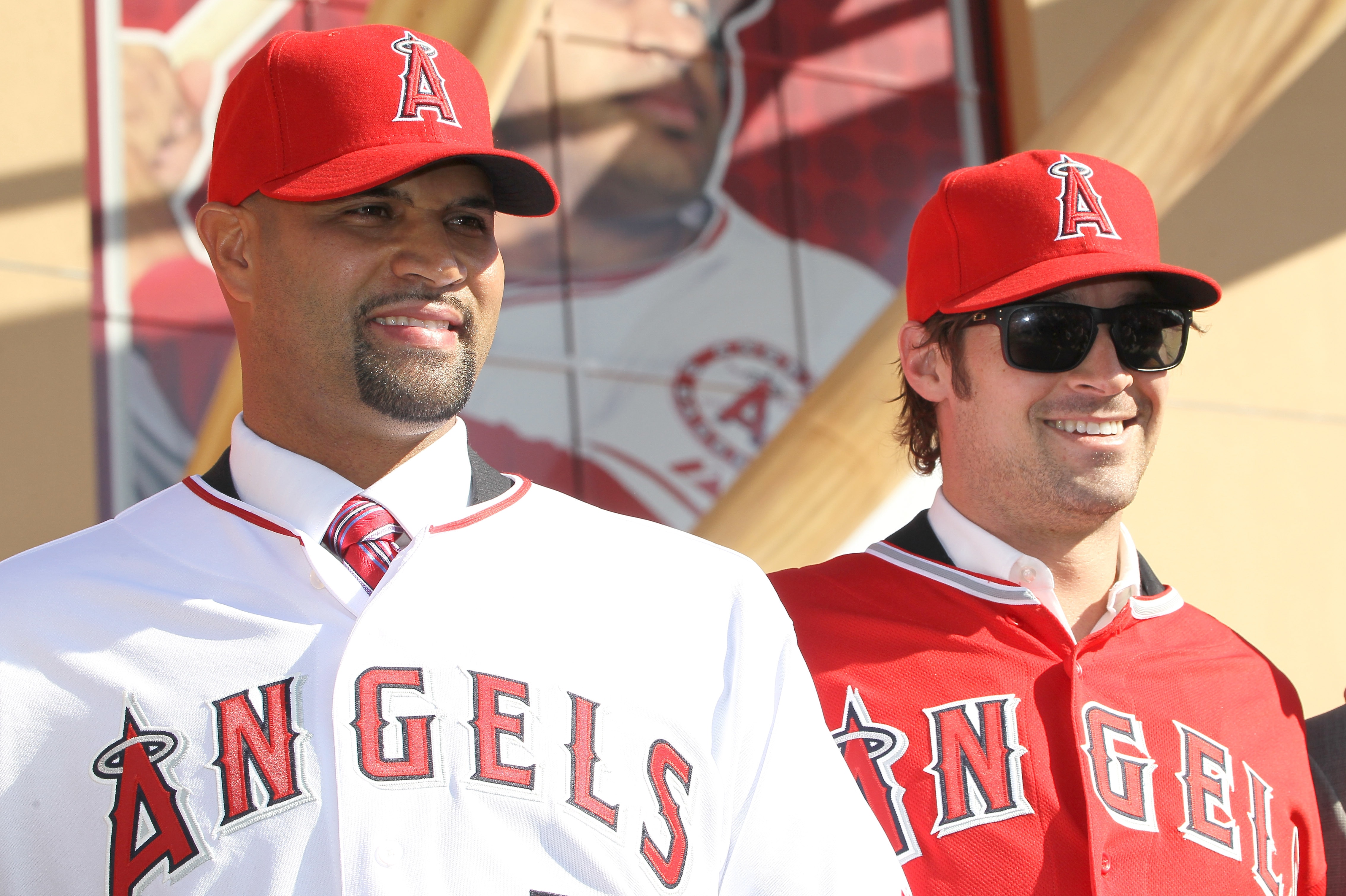 ANAHEIM, CA - DECEMBER 10: Albert Pujols #5 (L) and C.J. Wilson #33 stand together at a public press conference introducing them as newly signed Los Angeles Angels of Anaheim players at Angel Stadium on December 10, 2011 in Anaheim, California. (Photo by Stephen Dunn/Getty Images)