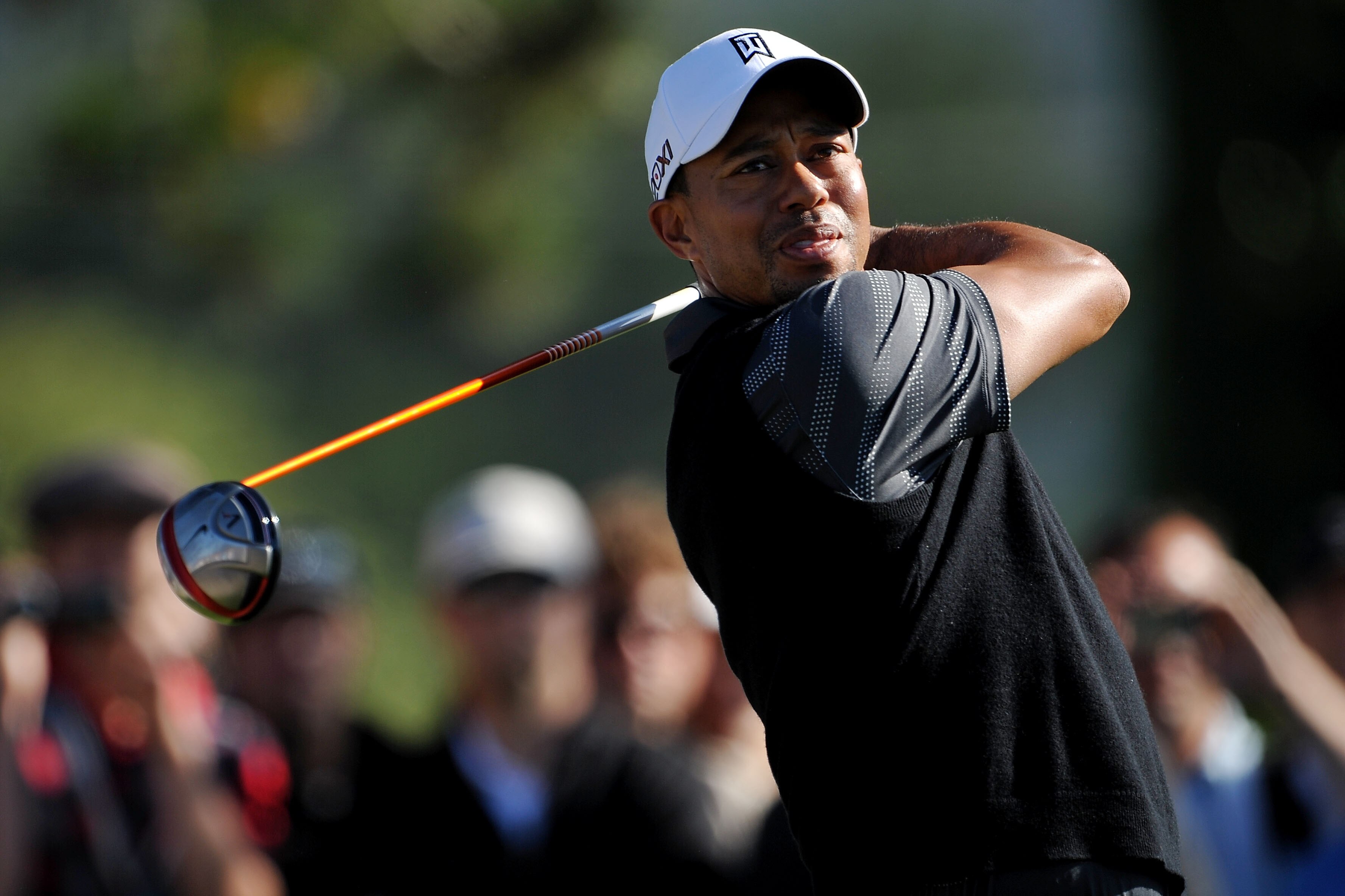 DALY CITY, CA - JUNE 11: Tiger Woods of the United States hits a tee shot during a practice round prior to the start of the 112th U.S. Open at The Olympic Club on June 11, 2012 in Daly City, California. (Photo by Stuart Franklin/Getty Images)
