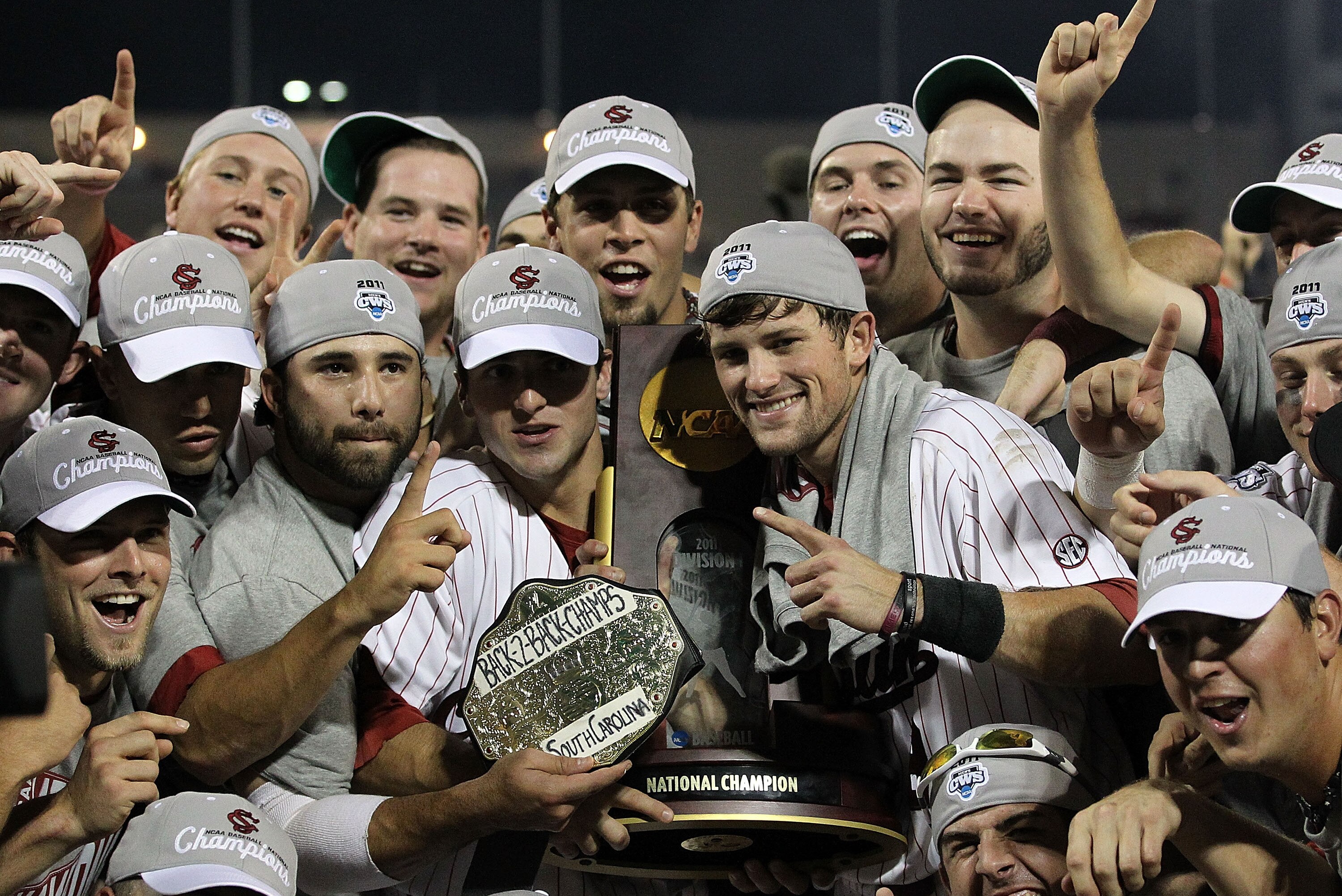OMAHA, NE - JUNE 28: (L-R) Brady Thomas #36 and Scott Wingo #8 of the South Carolina Gamecocks celebrate with the team while holding the trophy after winning the men's 2011 NCAA College Baseball World Series at TD Ameritrade Park Omaha on June 28, 2011 in Omaha, Nebraska. The Gamecocks defeated the Florida Gators 5-2 and won the series 2-0. (Photo by Ronald Martinez/Getty Images)