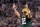 ARLINGTON, TX - FEBRUARY 06:  Aaron Rodgers #12 of the Green Bay Packers celebrates after an 8 yard touchdown pass to Greg Jennings against the Pittsburgh Steelers during Super Bowl XLV at Cowboys Stadium on February 6, 2011 in Arlington, Texas.  (Photo by Jamie Squire/Getty Images)