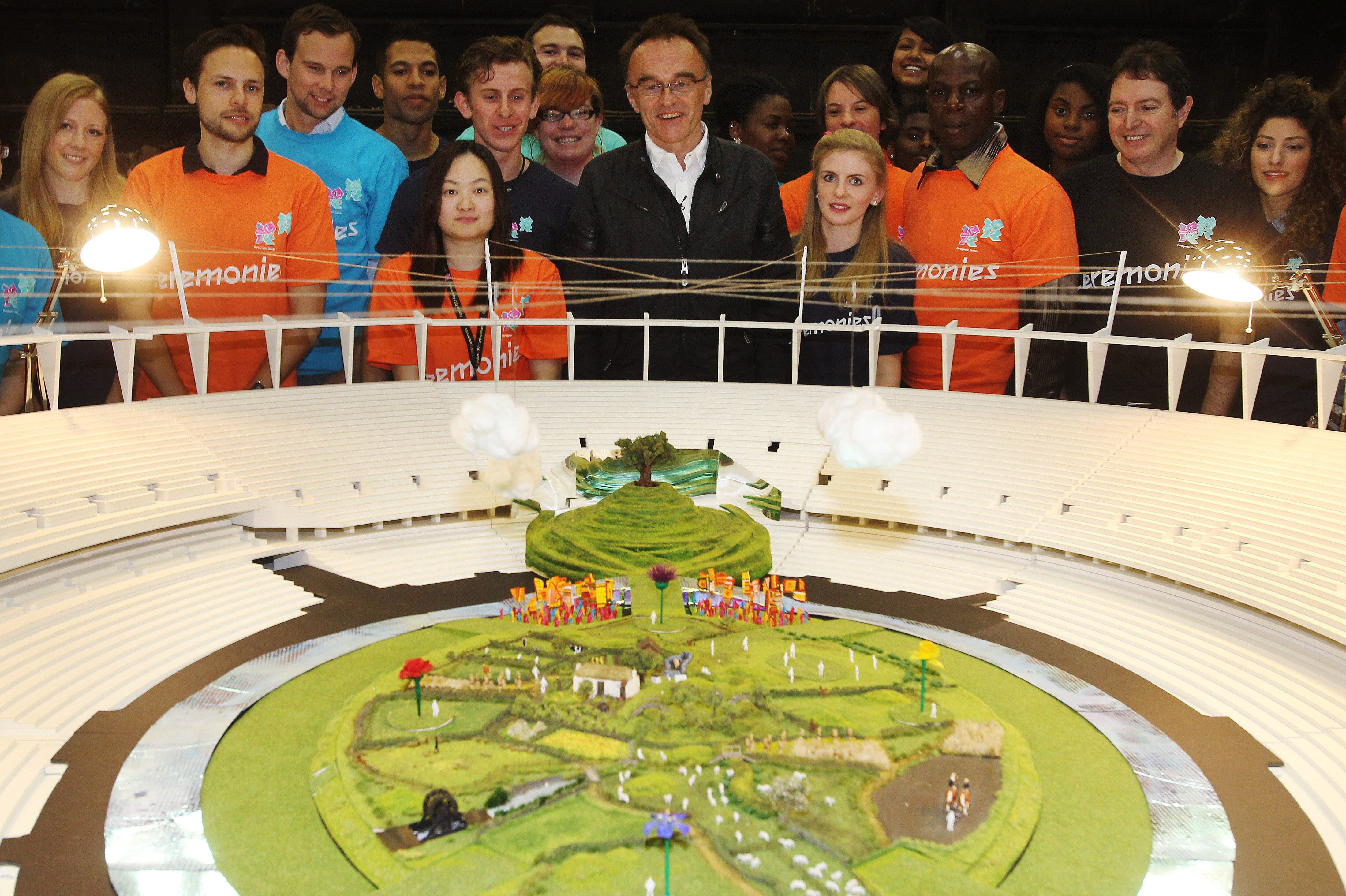 Danny Boyle poses in front of his Olympic ceremony model