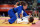 Jul 30, 2012; London, United Kingdom; Marti Malloy (USA), in blue, takes down Giulia Quintavalle (ITA) in the women's 57 kg judo bronze medal contest during the London 2012 Olympic Games at ExCeL - South Arena 3. Mandatory Credit: Matt Kryger-USA TODAY Sports