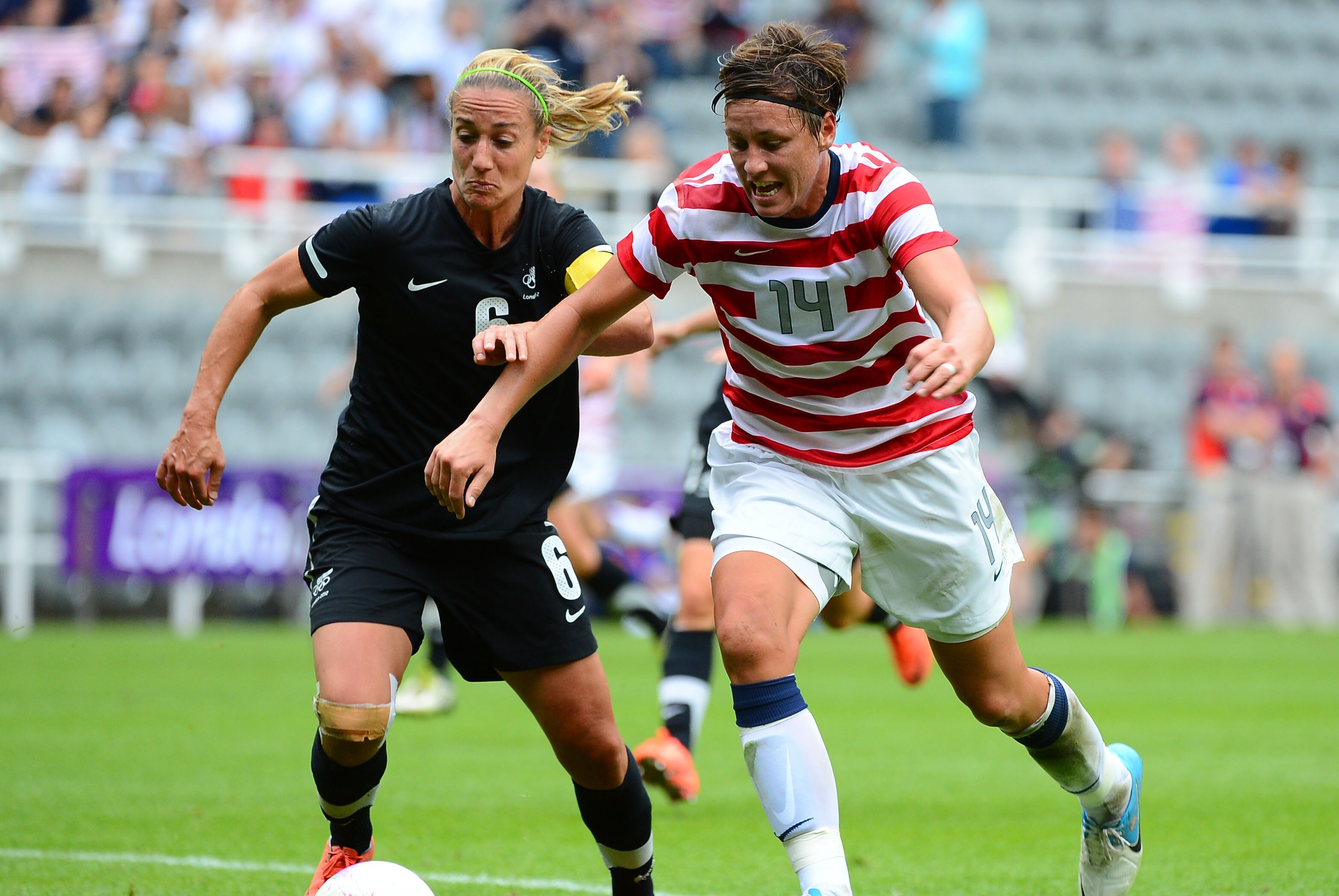 Aug 3, 2012; Newcastle, United Kingdom; USA forward Abby Wambach (14) works against New Zealand defender Rebecca Smith (6) in the second half of the women's quarterfinal match during the London 2012 Olympic Games at St James' Park. Mandatory Credit: Christopher Hanewinckel-USA TODAY Sports