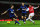 LONDON, ENGLAND - JANUARY 22:  Robin van Persie of Arsenal (R) shoots past Jonny Evans of Manchester United to score their first goal during the Barclays Premier League match between Arsenal and Manchester United at Emirates Stadium on January 22, 2012 in London, England.  (Photo by Mike Hewitt/Getty Images)