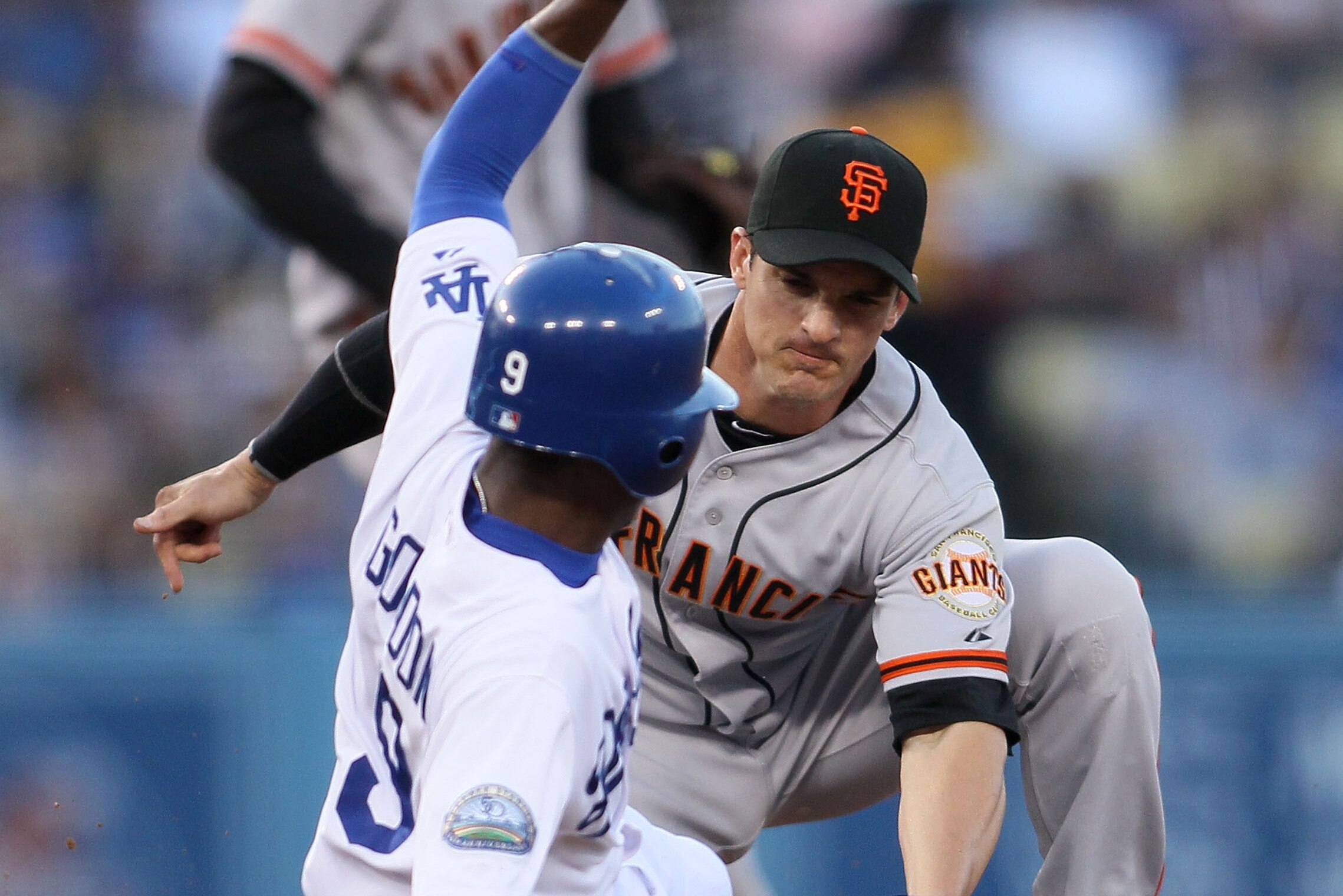 LOS ANGELES, CA - MAY 07: Secondbaseman Ryan Theriot #5 of the San Francisco Giants tags Dee Gordon #9 of the Los Angeles Dodgers at second base for an out in the first inning during the MLB game at Dodger Stadium on May 7, 2012 in Los Angeles, California. Gordon was tagged out trying to steal second. (Photo by Victor Decolongon/Getty Images)