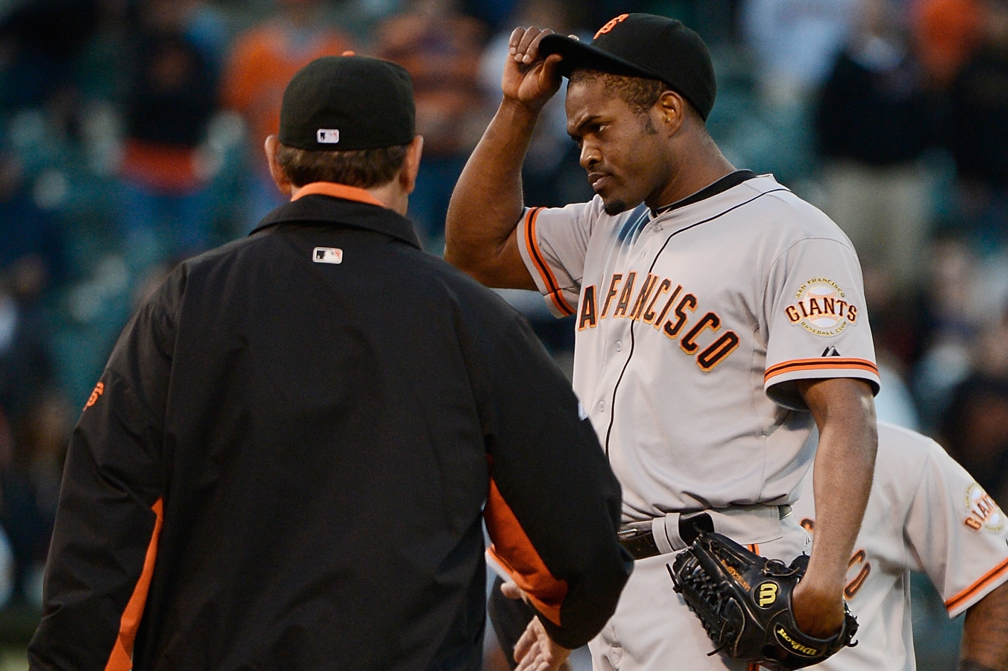 OAKLAND, CA - JUNE 23: Manager Bruce Bochy #15 of the San Francisco Giants comes to the mound to take Santiago Casilla #46 out of the game in the ninth inning against the Oakland Athletics at O.co Coliseum on June 23, 2012 in Oakland, California. (Photo by Thearon W. Henderson/Getty Images)