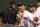 BOSTON, MA - AUGUST 7:  Bobby Valentine #25 of the Boston Red Sox has words with first base umpire Paul Nauet after Nauet ejected Dustin Pedroia #15 in the 9th inning against the Texas Rangers at Fenway Park August 7, 2012  in Boston, Massachusetts.  Adrian Gonzalez #28 of the Boston Red Sox is looking on. (Photo by Jim Rogash/Getty Images)