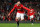 MANCHESTER, ENGLAND - MARCH 26:  Wayne Rooney of Manchester United celebrates as he scores their first goal during the Barclays Premier League match between Manchester United and Fulham at Old Trafford on March 26, 2012 in Manchester, England.  (Photo by Alex Livesey/Getty Images)