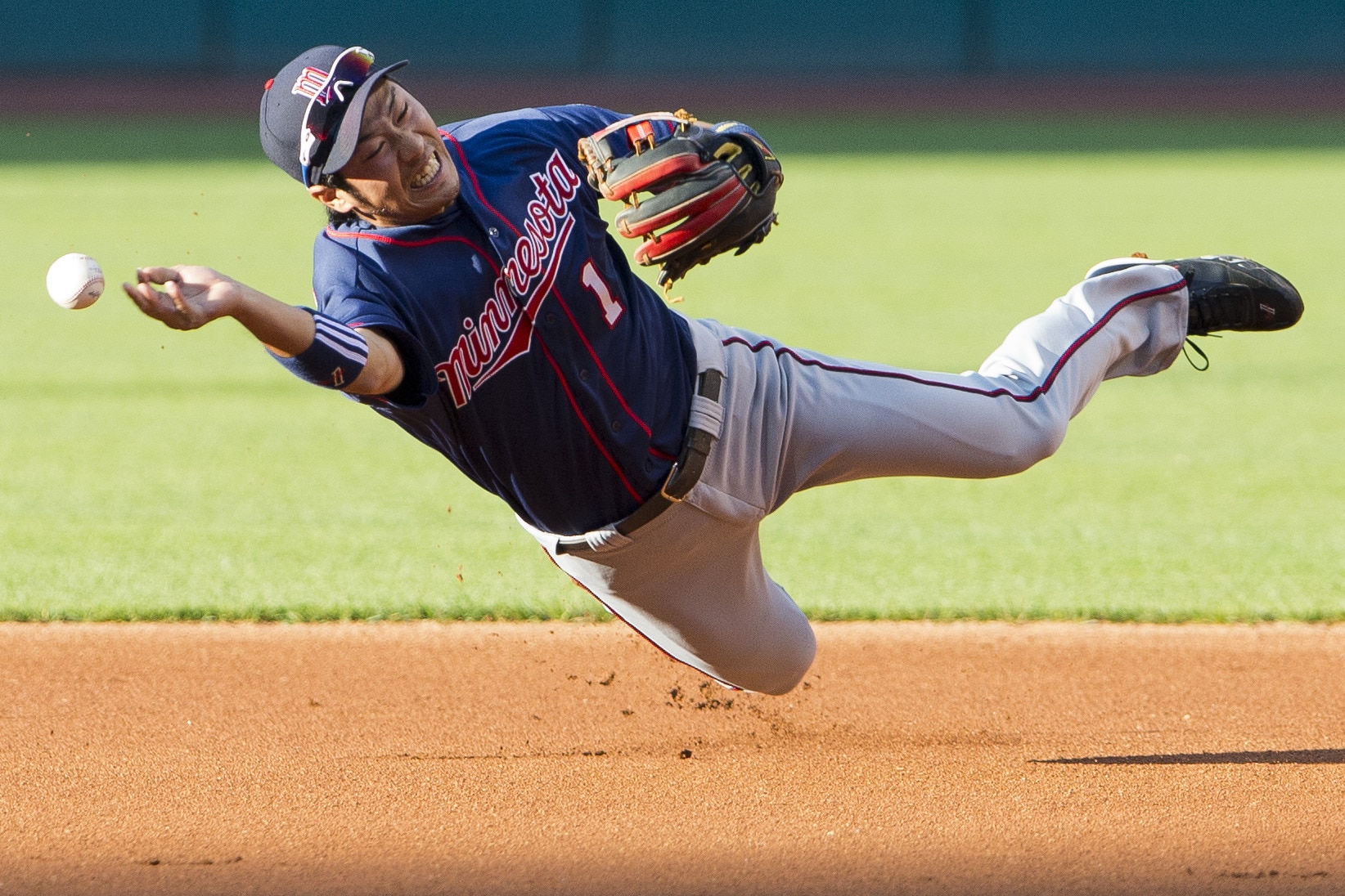 CLEVELAND, OH - AUGUST 6: Second baseman Tsuyoshi Nishioka #1 of the Minnesota Twins slips and falls as he tries to throw to first during the first inning against the Cleveland Indians at Progressive Field on August 6, 2012 in Cleveland, Ohio. (Photo by Jason Miller/Getty Images)