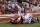 Sep 22, 2012; Norman, OK, USA; Oklahoma Sooner quarterback Landry Jones (12) has the ball knocked out of his hands by Kansas State Wildcats linebacker Justin Tuggle (2) and Jarrell Childs (26) recovered the fumble for a touchdown in the second quarter at Oklahoma Memorial Stadium. Mandatory Credit: Matthew Emmons-US PRESSWIRE