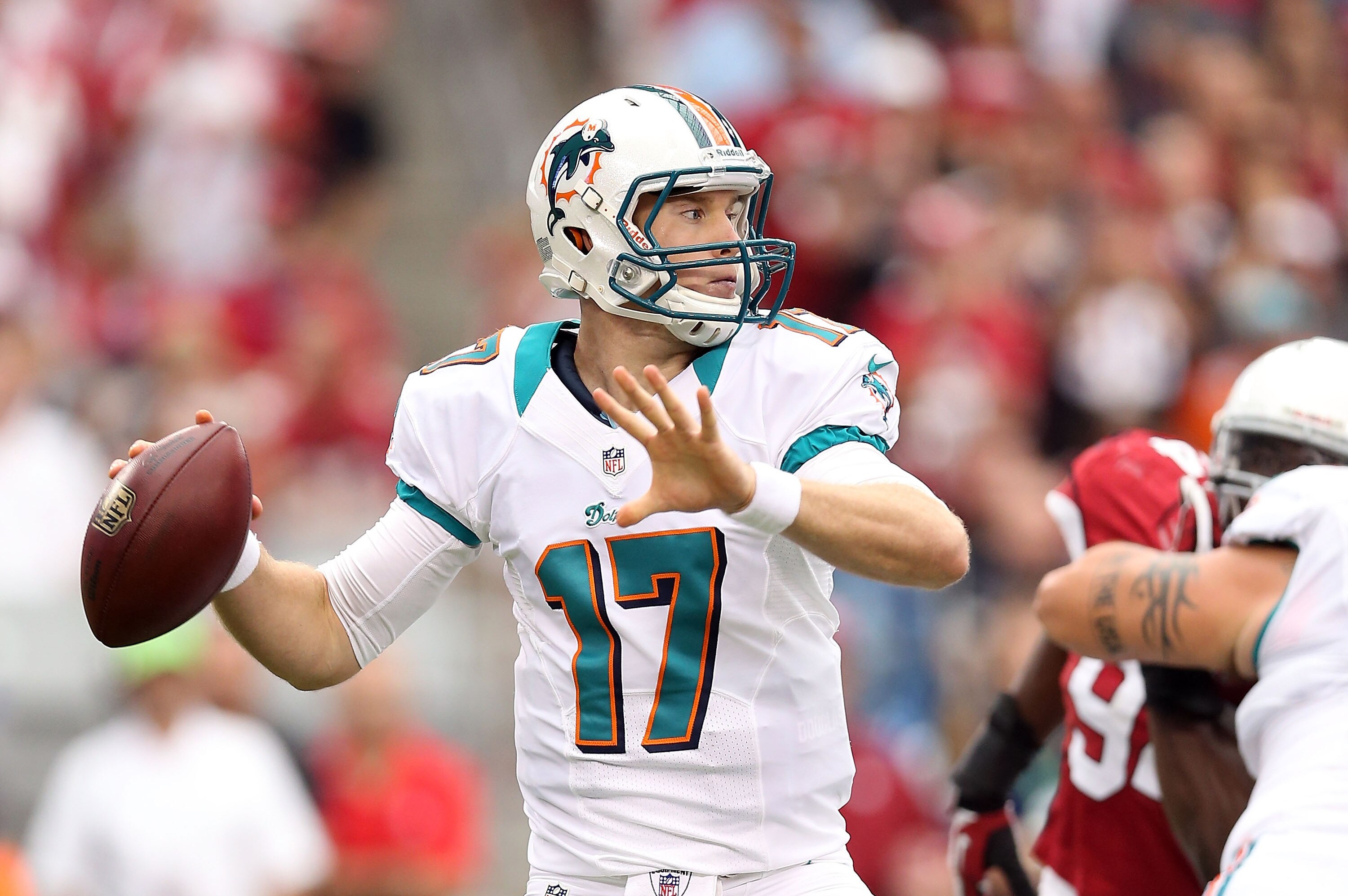 GLENDALE, AZ - SEPTEMBER 30: Quarterback Ryan Tannehill #17 of the Miami Dolphins throws a pass during the NFL game against the Arizona Cardinals at the University of Phoenix Stadium on September 30, 2012 in Glendale, Arizona. The Carindals defeated the Dolphins 24-21 in overtime. (Photo by Christian Petersen/Getty Images)