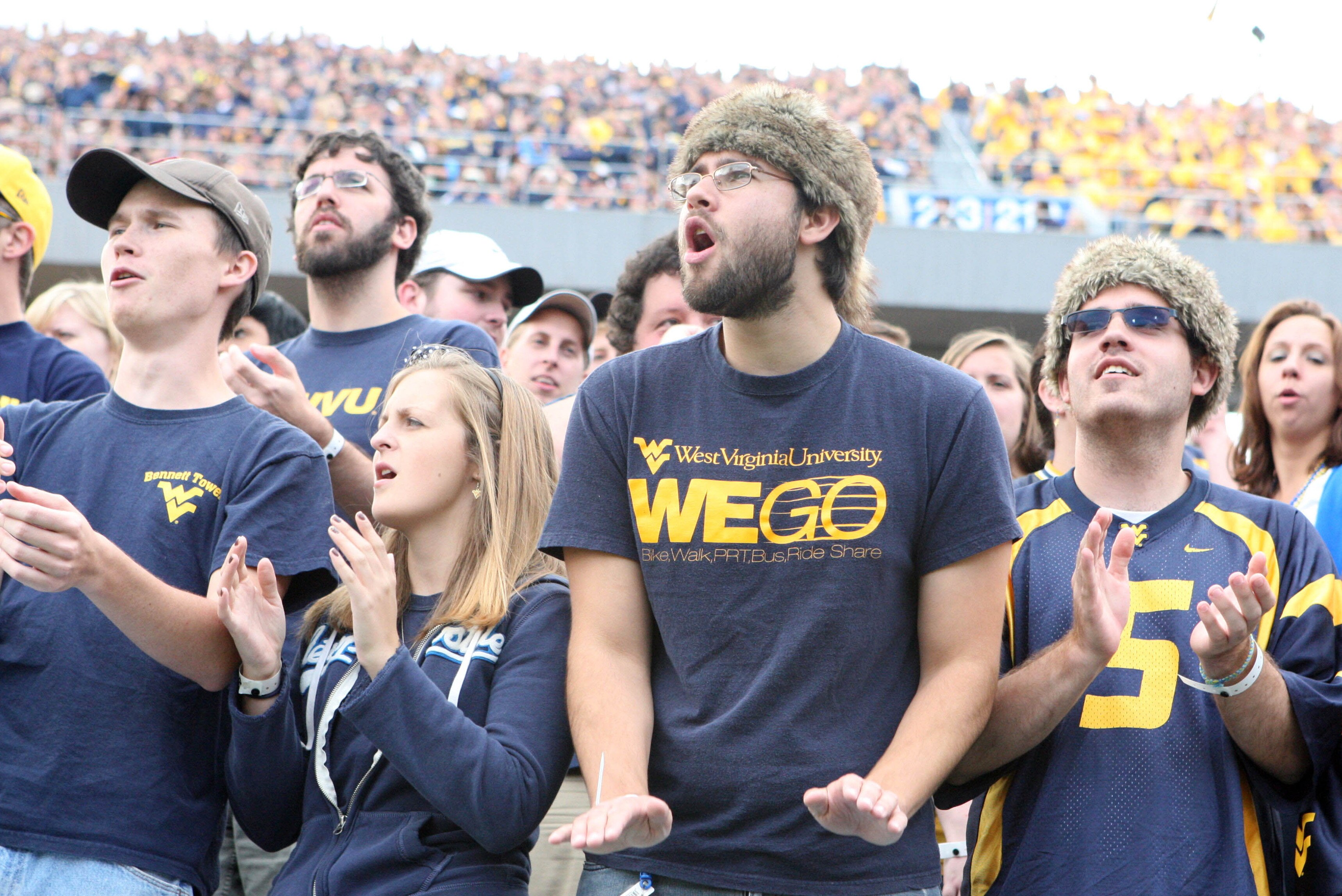 September 29, 2012; Morgantown, WV, USA; West Virginia Mountaineers fans react after a touchdown in the second half against the Baylor Bears at Milan Puskar Stadium. West Virginia defeated Baylor 70-63. Mandatory Credit: Rob Christy-US PRESSWIRE