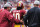 LANDOVER, MD - OCTOBER 07: Quarterback Robert Griffin III #10 of the Washington Redskins is attended to after taking a hard hit against the Atlanta Falcons in the third quarter at FedExField on October 7, 2012 in Landover, Maryland. Robert Griffin III left the game after the hit. (Photo by Patrick Smith/Getty Images)