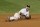 Already badly hurt, Jeter is about to throw the ball in his glove.