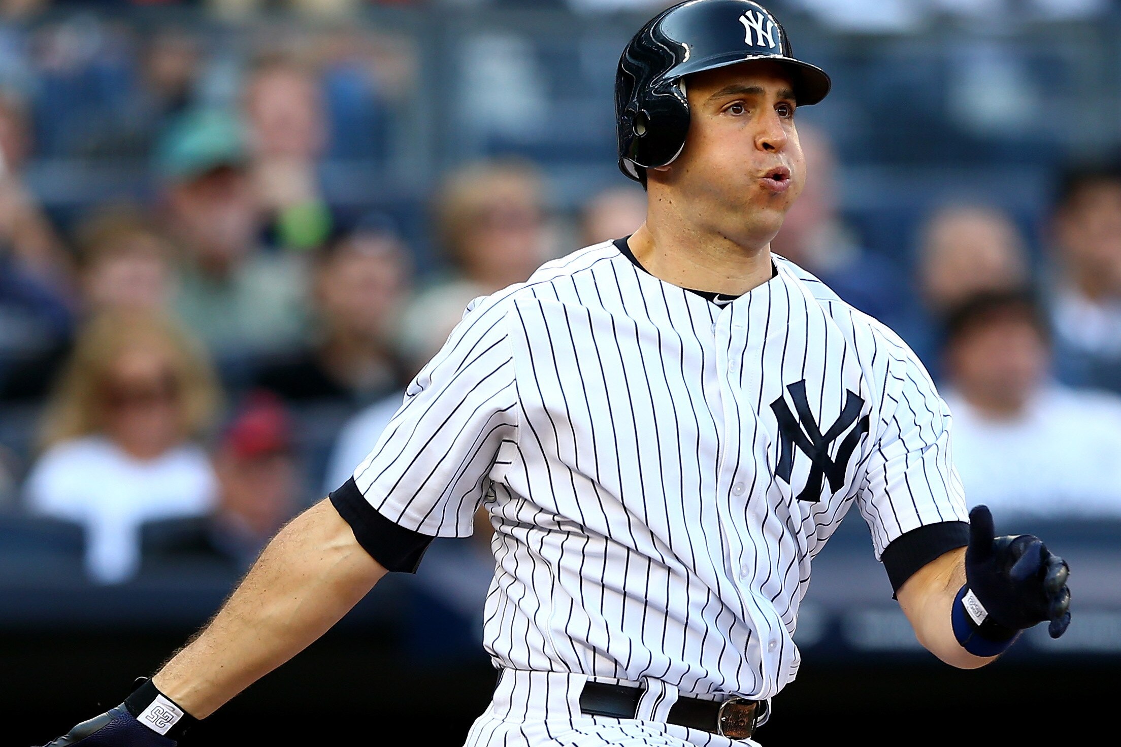 NEW YORK, NY - OCTOBER 14: Mark Teixeira #25 of the New York Yankees hits a double in the bottom of the first inning against the Detroit Tigers during Game Two of the American League Championship Series at Yankee Stadium on October 14, 2012 in the Bronx borough of New York City. (Photo by Elsa/Getty Images)