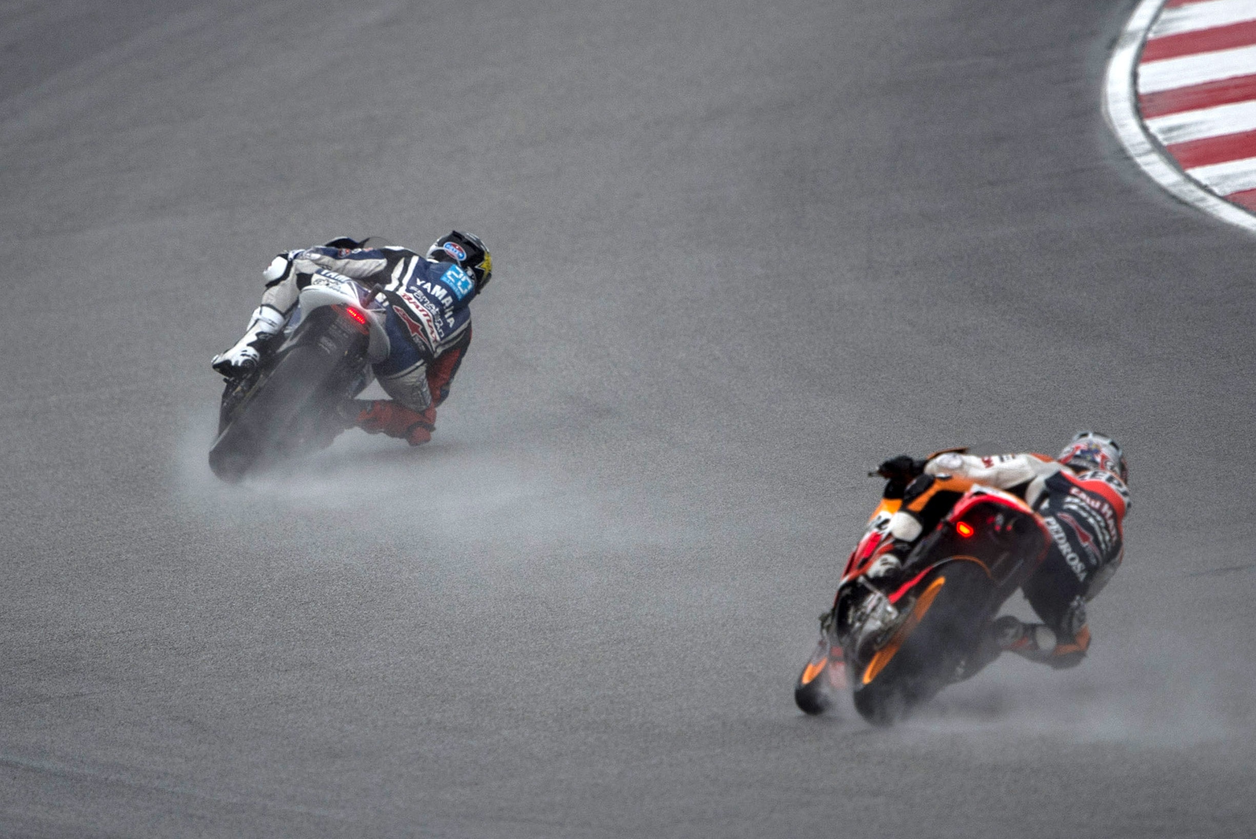 KUALA LUMPUR, MALAYSIA - OCTOBER 21: Jorge Lorenzo of Spain and Yamaha Factory Team leads Dani Pedrosa of Spain and Repsol Honda Team during the MotoGP race during the MotoGP Of Malaysia at Sepang Circuit on October 21, 2012 in Kuala Lumpur, Malaysia. (Photo by Mirco Lazzari gp/Getty Images)