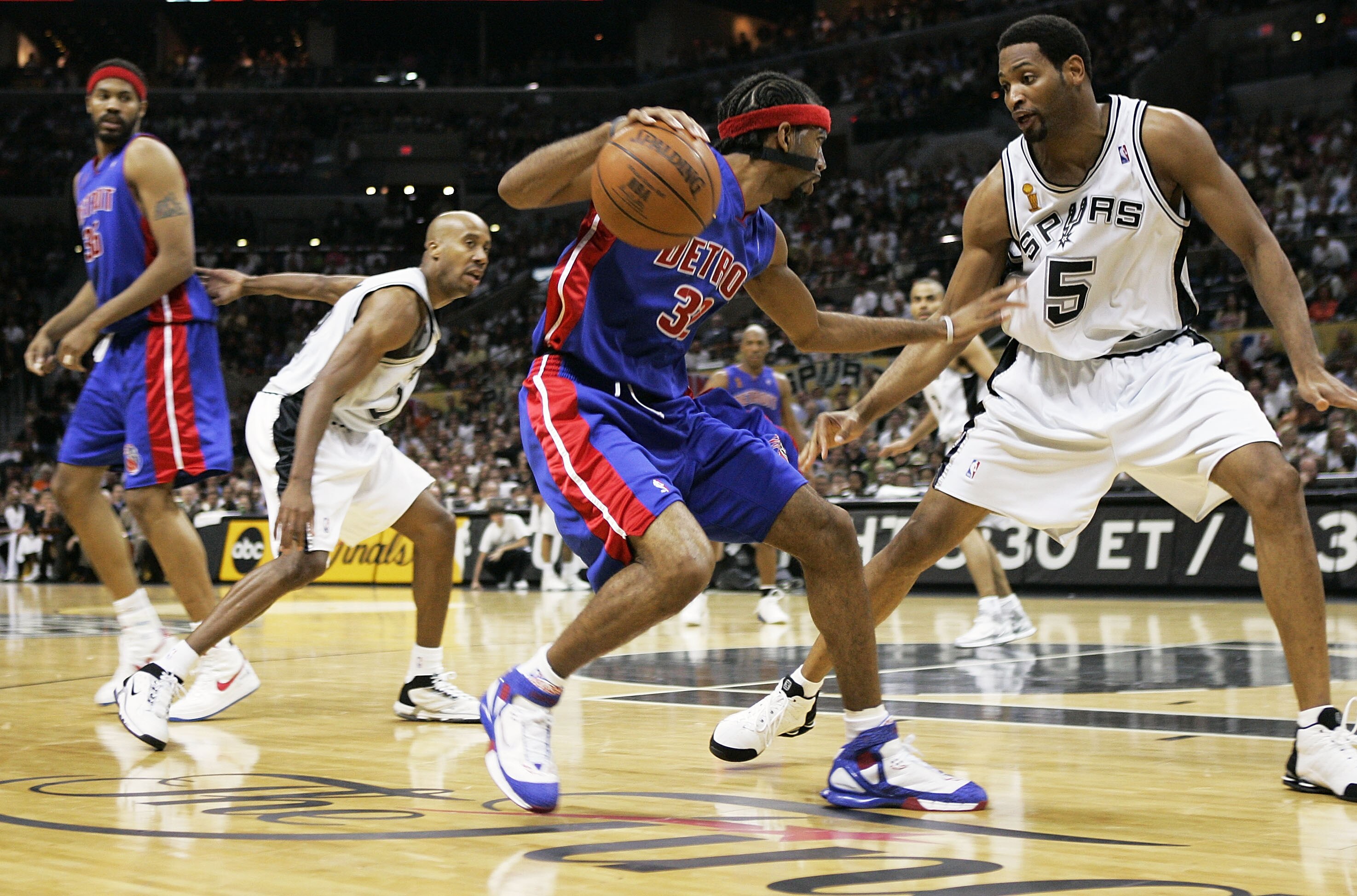 SAN ANTONIO - JUNE 12: After a pick-and-roll in the second quarter, Robert Horry #5 of the San Antonio Spurs is left to cover Richard Hamilton #32 of the Detroit Pistons as Bruce Bowen #12 defends Rasheed Wallace #36 in Game two of the 2005 NBA Finals on June 12, 2005 at SBC Center in San Antonio, Texas. NOTE TO USER: User expressly acknowledges and agrees that, by downloading and or using this photograph, User is consenting to the terms and conditions of the Getty Images License Agreement. (Photo by Brian Bahr/Getty Images)