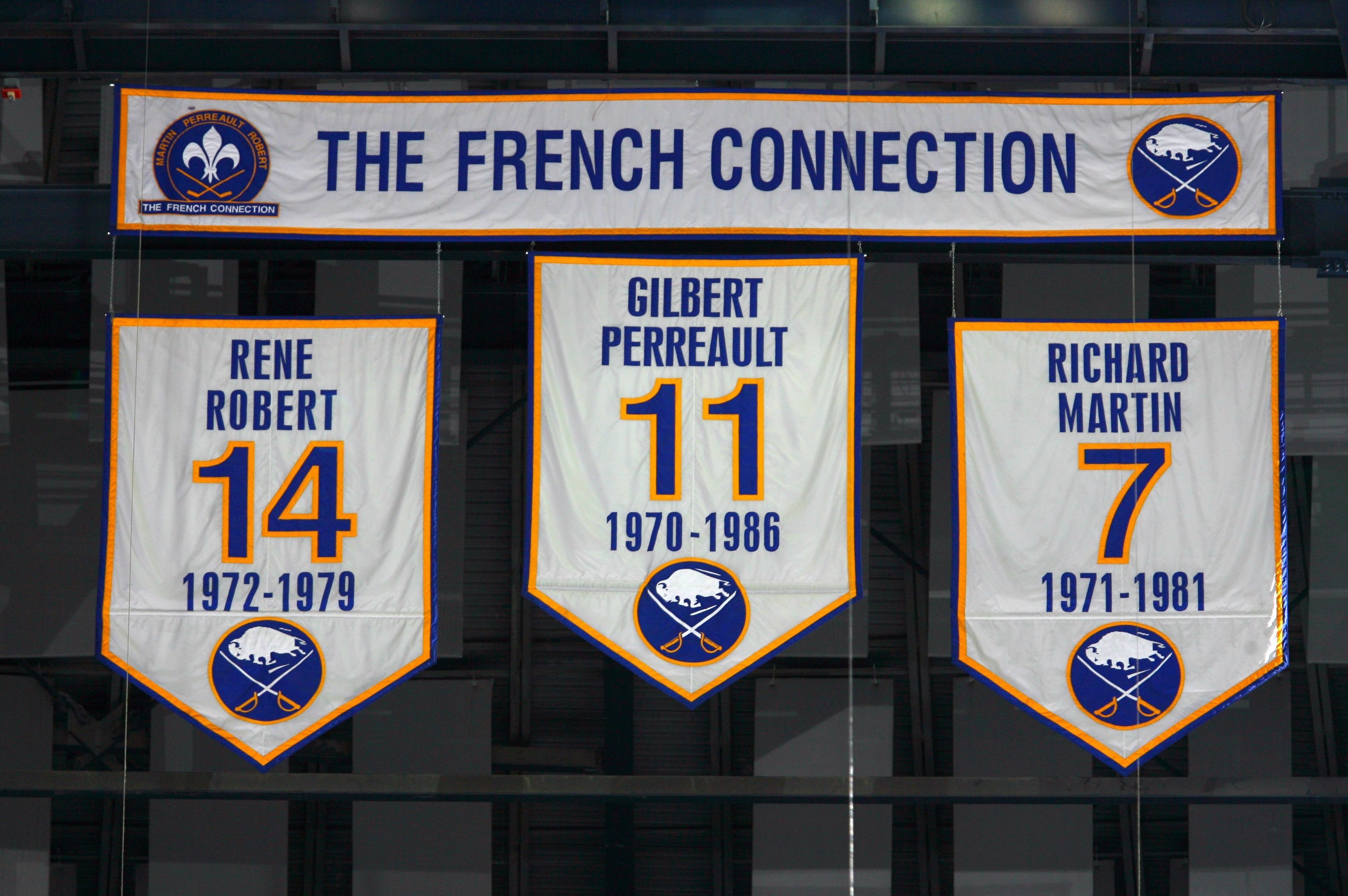 BUFFALO, NY - OCTOBER 3: Banners of the numbers of the former Buffalo Sabres 'French Connection' line of Rene Robert #14, Gilbert Perreault #11 and Richard Martin #7 hang from the rafters during the NHL game between the Buffalo Sabres and the Montreal Canadiens at HSBC Arena on October 3, 2009 in Buffalo, New York. The Canadiens defeated the Sabres 2-1 in overtime. (Photo by Rick Stewart/Getty Images)