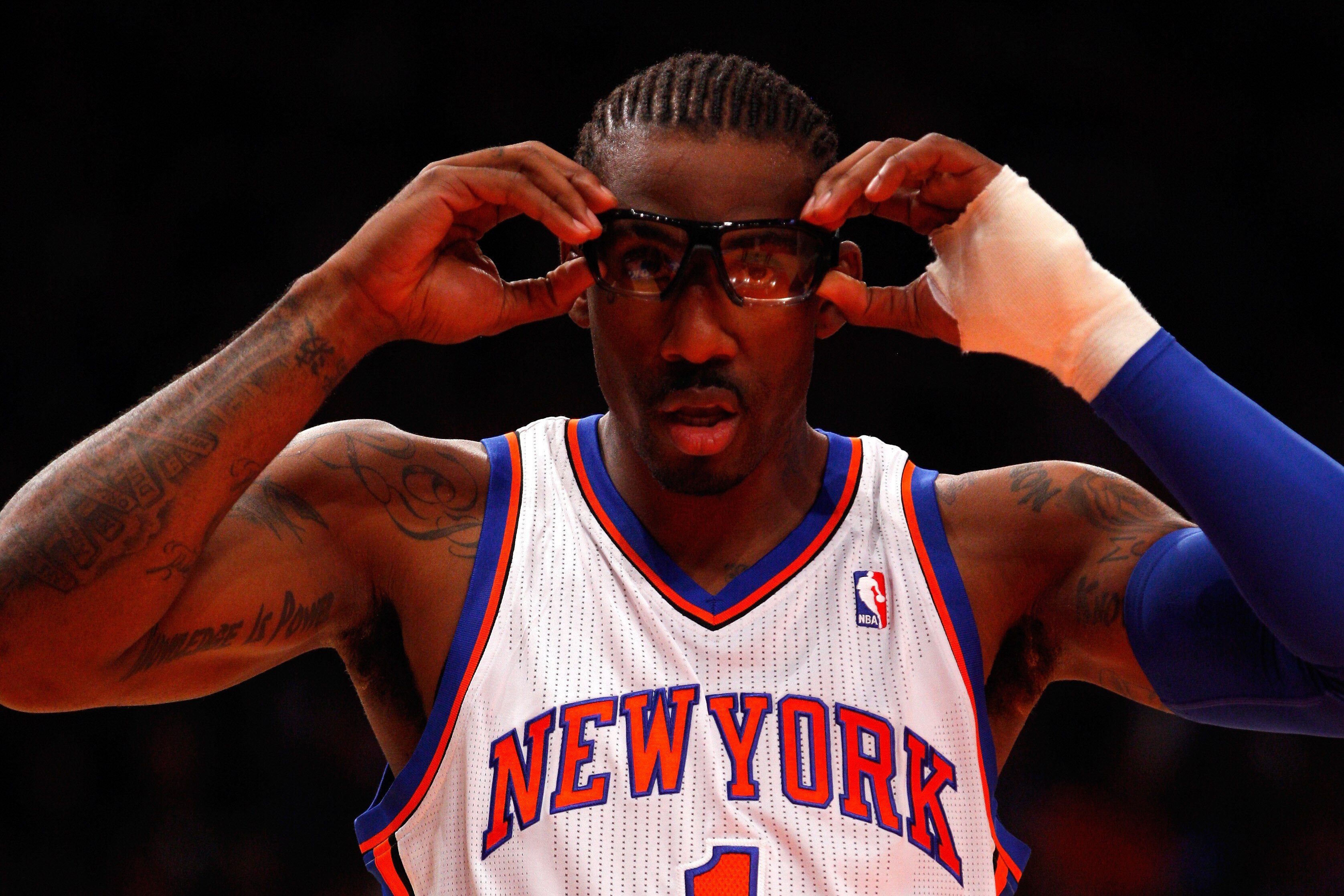 NEW YORK, NY - MAY 06: Amare Stoudemire #1 of the New York Knicks adjusts his glasses as he gets set to play against the Miami Heat in Game Four of the Eastern Conference Quarterfinals in the 2012 NBA Playoffs on May 6, 2012 at Madison Square Garden in New York City. NOTE TO USER: User expressly acknowledges and agrees that, by downloading and or using this photograph, User is consenting to the terms and conditions of the Getty Images License Agreement (Photo by Jeff Zelevansky/Getty Images)