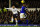 LIVERPOOL, ENGLAND - DECEMBER 09:  Everton player Sylvain Distin can only watch as Spurs player Gylfi Sigurdsson gets in a shot at goal during the Barclays Premier game between Everton and Tottenham Hotspur at Goodison Park on December 9, 2012 in Liverpool, England.  (Photo by Stu Forster/Getty Images)