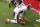 GLENDALE, AZ - DECEMBER 23:  Brandon Marshall #15 of the Chicago Bears kneels at the back of the endzone after scoring a touchdown against the Arizona Cardinals at University of Phoenix Stadium on December 23, 2012 in Glendale, Arizona.  (Photo by Norm Hall/Getty Images)