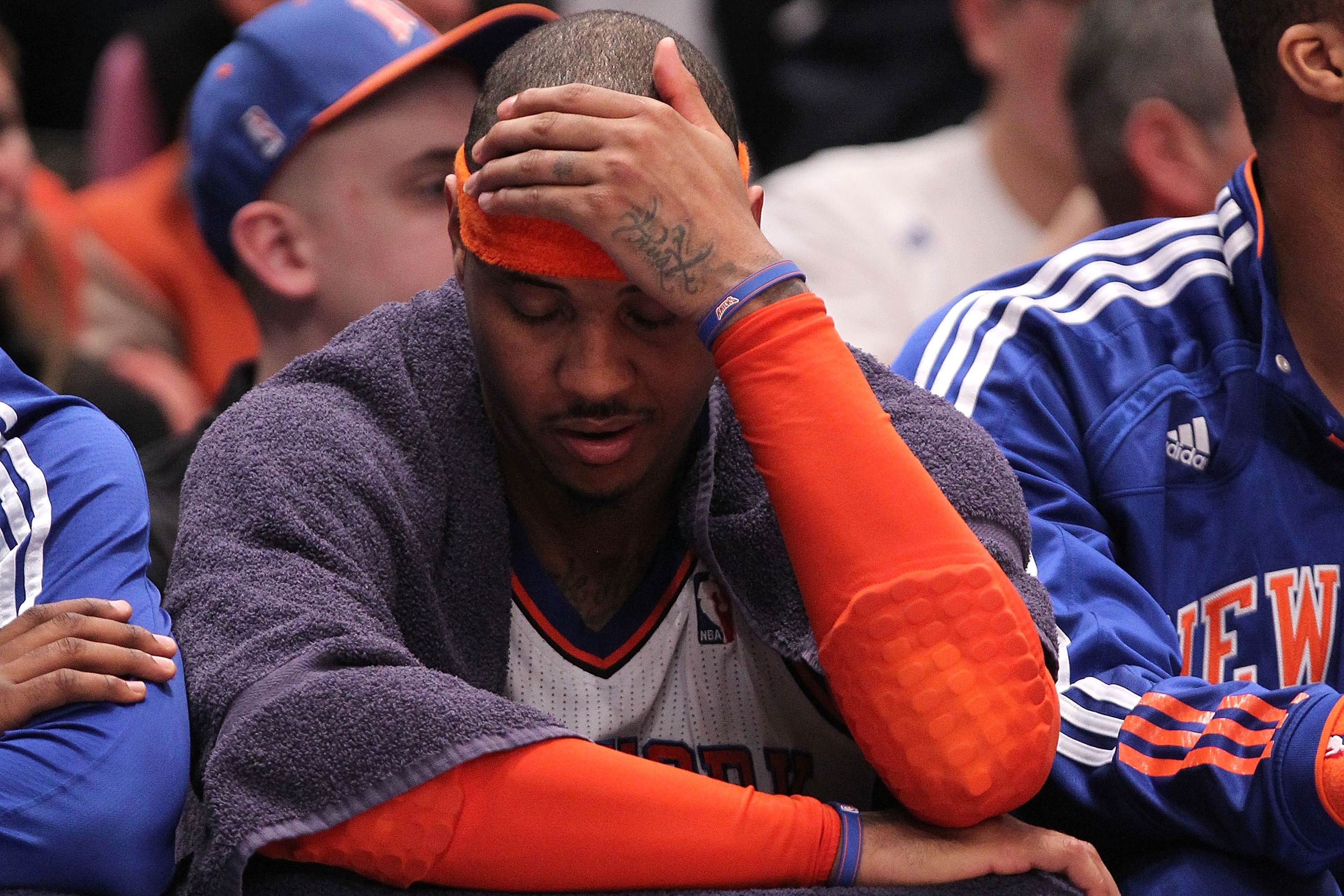 NEW YORK, NY - APRIL 22: Carmelo Anthony #7 of the New York Knicks sits on the bench dejected late in the second half against the Boston Celtics in Game Three of the Eastern Conference Quarterfinals in the 2011 NBA Playoffs on April 22, 2011 at Madison Square Garden in New York City. The Celtics won 1113-96. NOTE TO USER: User expressly acknowledges and agrees that, by downloading and or using this photograph, User is consenting to the terms and conditions of the Getty Images License Agreement. (Photo by Nick Laham/Getty Images)