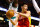 BOSTON, MA - JANUARY 11:  Jeremy Lin #7 of the Houston Rockets passes the ball underneath the basket against the Boston Celtics during the game on January 11, 2013 at TD Garden in Boston, Massachusetts. NOTE TO USER: User expressly acknowledges and agrees that, by downloading and or using this photograph, User is consenting to the terms and conditions of the Getty Images License Agreement. (Photo by Jared Wickerham/Getty Images)