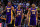 December 22, 2012; Oakland, CA, USA; Los Angeles Lakers center Dwight Howard (12), shooting guard Kobe Bryant (24), and small forward Metta World Peace (15) walk back onto the court during the fourth quarter against the Golden State Warriors at ORACLE Arena. The Lakers defeated the Warriors 118-115 in overtime. Mandatory Credit: Kyle Terada-USA TODAY Sports