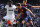 MADRID, SPAIN - MARCH 02: Michael Essien (L) of Real Madrid CF vies with Jordi Alba (C) and Sergio Busquets of FC Barcelona during the La Liga match between Real Madrid CF and FC Barcelona at Bernabeu on March 2, 2013 in Madrid, Spain.  (Photo by David Ramos/Getty Images)