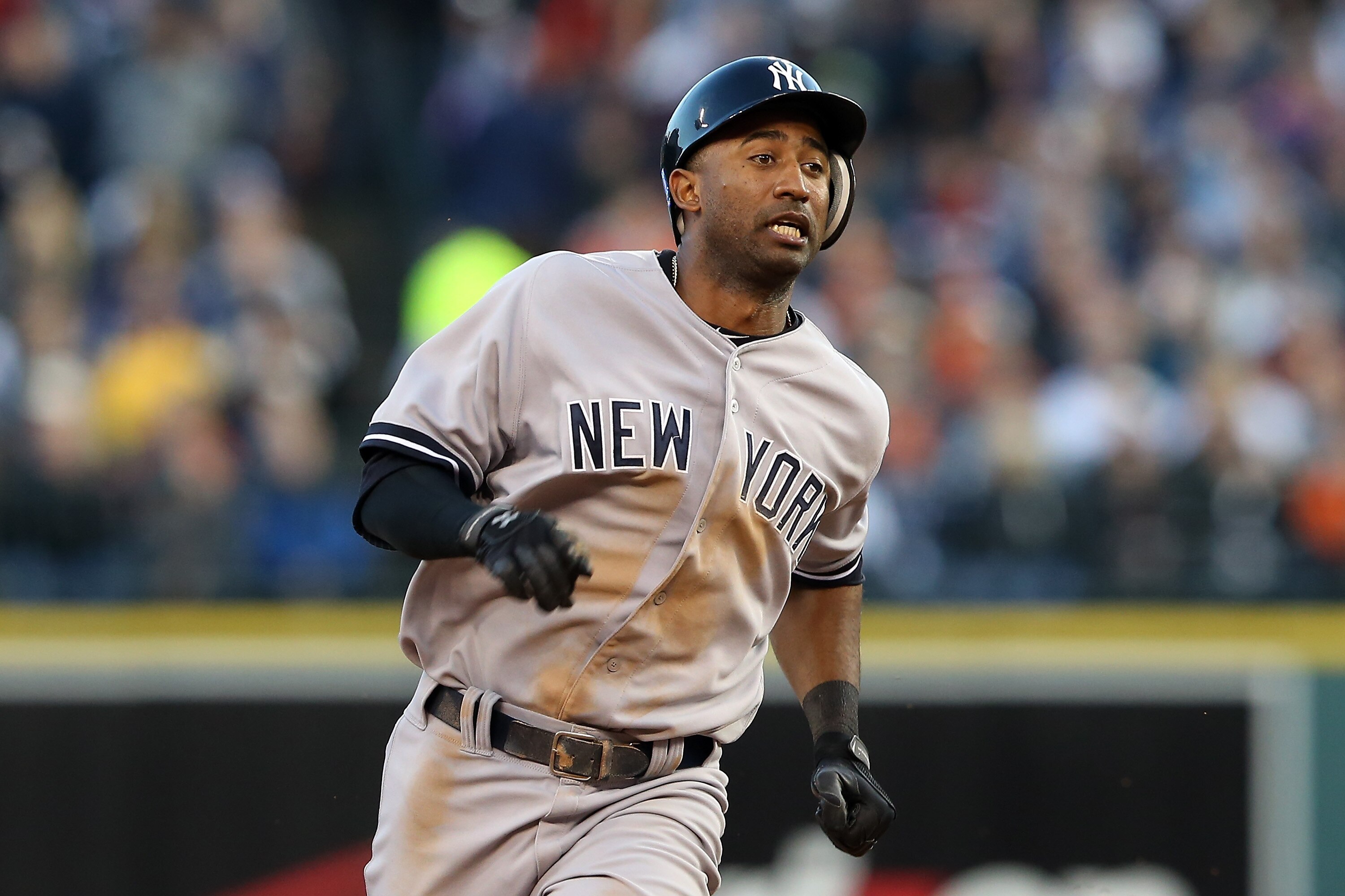 DETROIT, MI - OCTOBER 18: Eduardo Nunez #26 of the New York Yankees runs towards third base as he scores on a RBI double by Nick Swisher #33 in the top of the sixth inning against the Detroit Tigers during game four of the American League Championship Series at Comerica Park on October 18, 2012 in Detroit, Michigan. (Photo by Leon Halip/Getty Images)