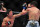 Feb 2, 2013; Las Vegas, NV, USA; Joseph Benavidez (left) lands a jab on Ian McCall (right) during UFC 156 at the Mandalay Bay Events Center. Mandatory Credit: Gary A. Vasquez-USA TODAY Sports