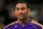 DENVER, CO - FEBRUARY 25:  Metta World Peace #15 of the Los Angeles Lakers looks on during warm ups prior to facing the Denver Nuggets at the Pepsi Center on February 25, 2013 in Denver, Colorado. The Nuggets defeated the Lakers 119-108. NOTE TO USER: User expressly acknowledges and agrees that, by downloading and or using this photograph, User is consenting to the terms and conditions of the Getty Images License Agreement.  (Photo by Doug Pensinger/Getty Images)