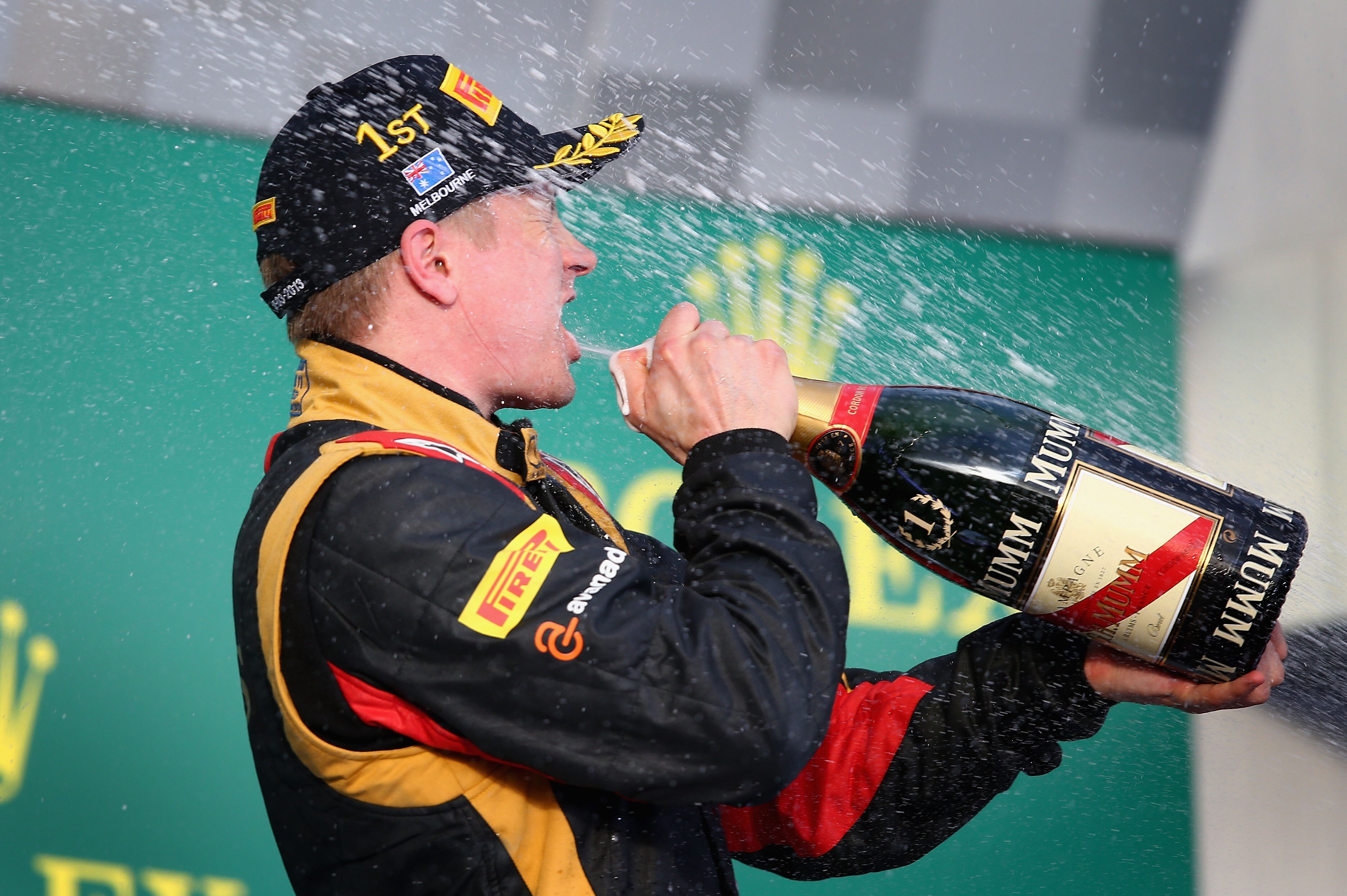 MELBOURNE, AUSTRALIA - MARCH 17: Kimi Raikkonen of Finland and Lotus celebrates on the podium after winning the Australian Formula One Grand Prix at the Albert Park Circuit on March 17, 2013 in Melbourne, Australia. (Photo by Clive Mason/Getty Images)