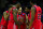 KANSAS CITY, MO - MARCH 22: Marshall Henderson #22 of the Ole Miss Rebels and team huddle together in the second half against the Wisconsin Badgers during the second round of the 2013 NCAA Men's Basketball Tournament at the Sprint Center on March 22, 2013 in Kansas City, Missouri.  (Photo by Jamie Squire/Getty Images)