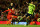 LIVERPOOL, ENGLAND - DECEMBER 15:  Luis Suarez of Liverpool shoots past Karim El Ahmadi of Aston Villa during the Barclays Premier League match between Liverpool and Aston Villa at Anfield on  December 15, 2012 in Liverpool, England.  (Photo by Clive Brunskill/Getty Images)