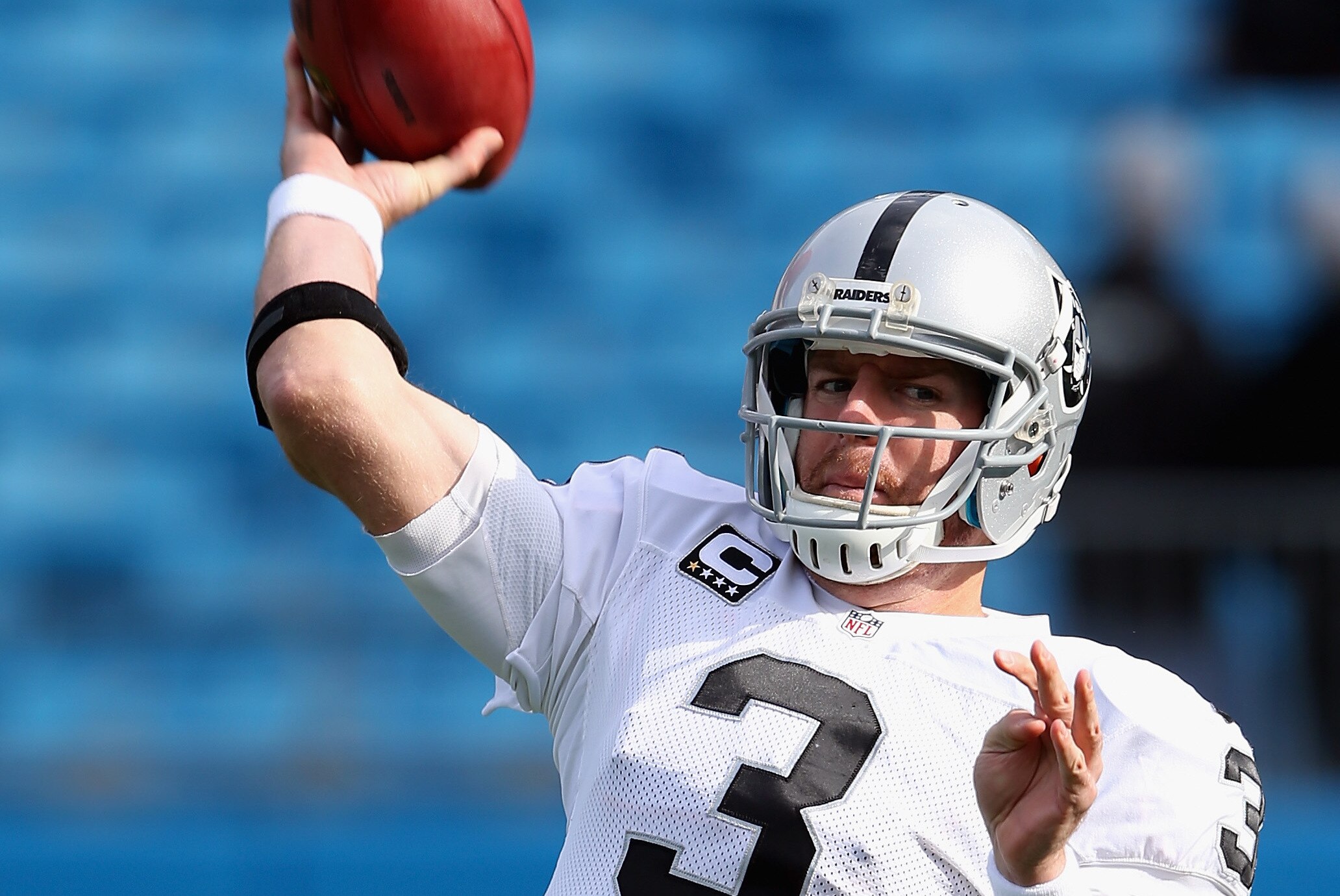 CHARLOTTE, NC - DECEMBER 23: Carson Palmer #3 of the Oakland Raiders warms up before their game against the Carolina Panthers at Bank of America Stadium on December 23, 2012 in Charlotte, North Carolina. (Photo by Streeter Lecka/Getty Images)