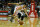 HOUSTON, TX - MARCH 24:  Jeremy Lin #7 of the Houston Rockets reaches for the ball in front of Tony Parker #9 of the San Antonio Spurs at Toyota Center on March 24, 2013 in Houston, Texas. NOTE TO USER: User expressly acknowledges and agrees that, by downloading and or using this photograph, User is consenting to the terms and conditions of the Getty Images License Agreement.  (Photo by Scott Halleran/Getty Images)