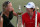 DUBAI, UNITED ARAB EMIRATES - NOVEMBER 25:  Caroline Wozniacki of Denmark and Rory McIlroy of Northern Ireland with the DP World Tour Championship and The Race to Dubai trophy on the 18th green during the final roung of the DP World Tour Championship on the Earth Course at Jumeirah Golf Estates on November 25, 2012 in Dubai, United Arab Emirates.  (Photo by Ross Kinnaird/Getty Images)