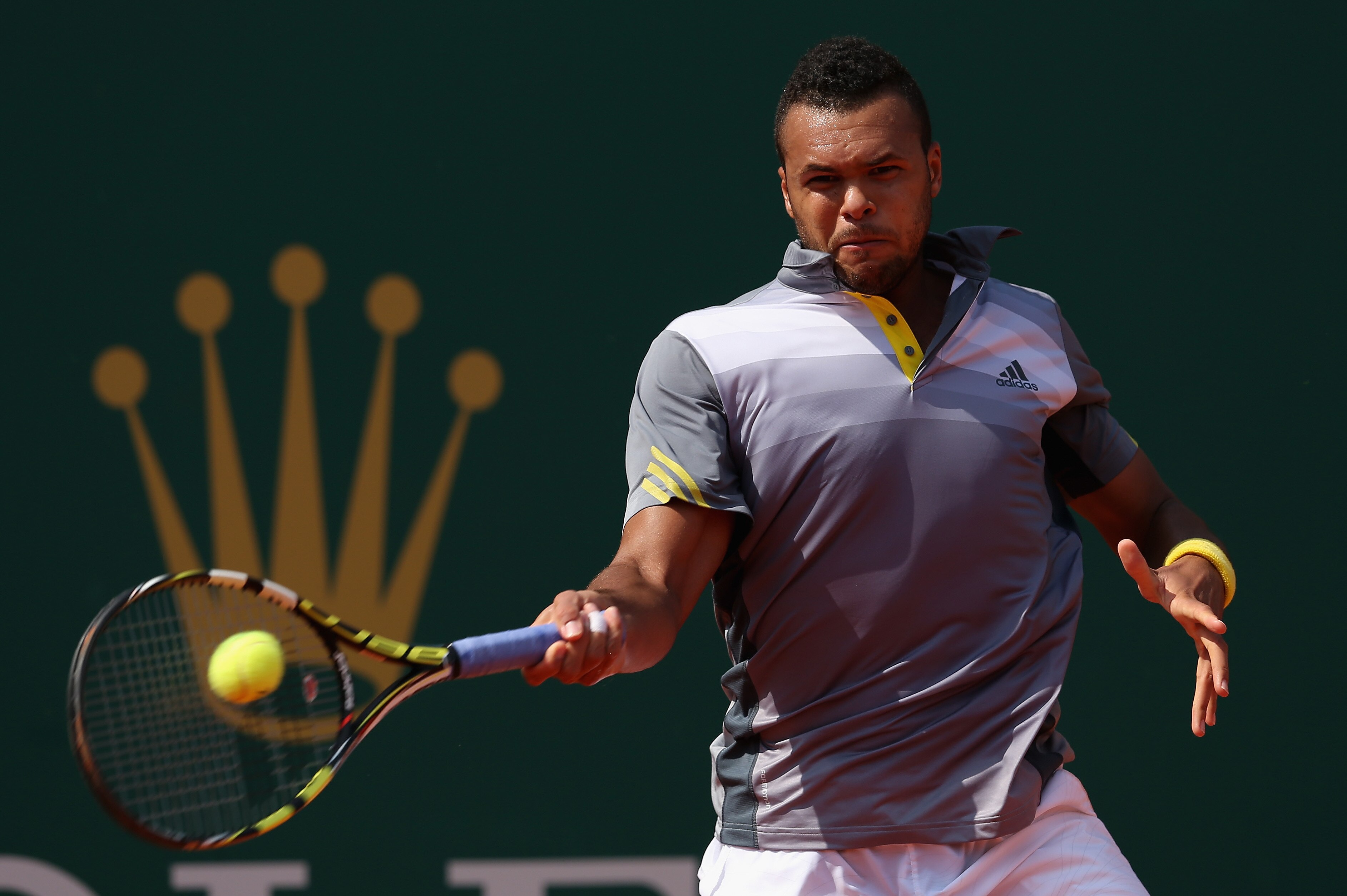 MONTE-CARLO, MONACO - APRIL 16: Jo-Wilfried Tsonga of France plays a forehand against Nikolay Davydenko of Russia in their second round match during day three of the ATP Monte Carlo Masters,at Monte-Carlo Sporting Club on April 16, 2013 in Monte-Carlo, Monaco. (Photo by Clive Brunskill/Getty Images)