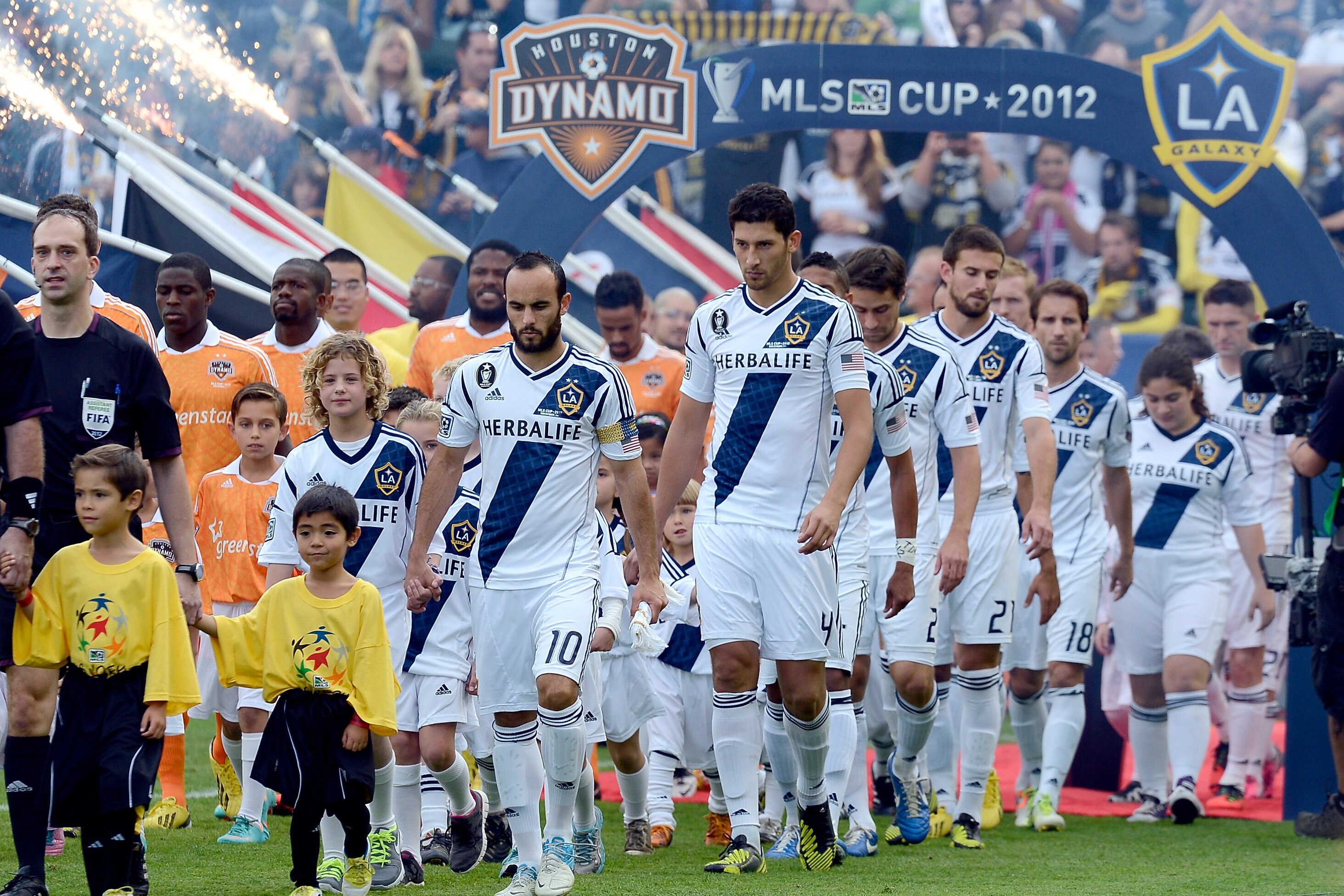 CARSON, CA - DECEMBER 01: Landon Donovan #10 and Omar Gonzalez #4 of Los Angeles Galaxy lead their teams on to the field before taking on the Houston Dynamo in the 2012 MLS Cup at The Home Depot Center on December 1, 2012 in Carson, California. (Photo by Kevork Djansezian/Getty Images)