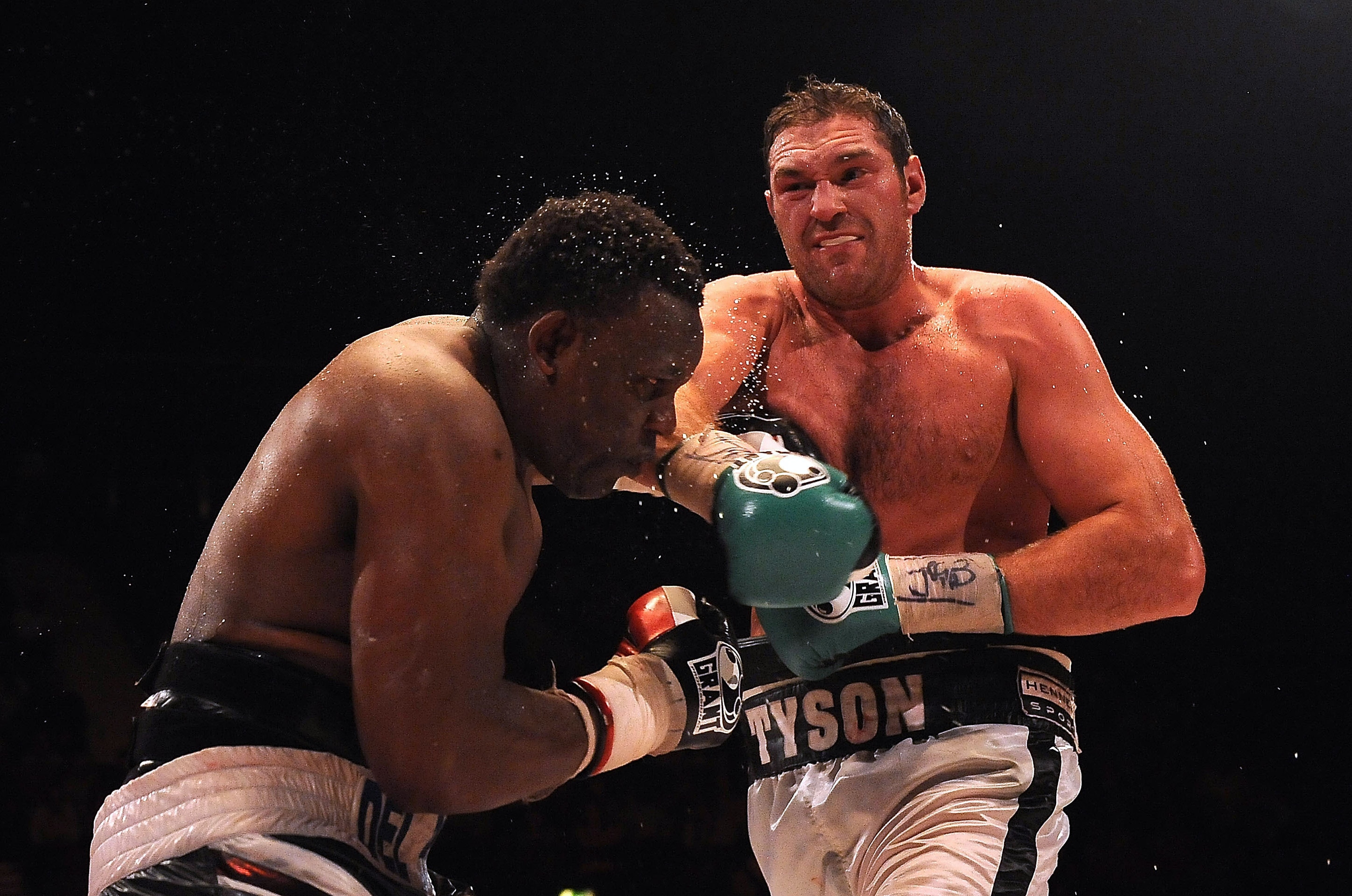 LONDON, ENGLAND - JULY 23:  Tyson Fury (R) throws a punch at Dereck Chisora during the British & Commonwealth Heavyweight Title Fight between Dereck Chisora and Tyson Fury at Wembley Arena on July 23, 2011 in London, England.  (Photo by Christopher Lee/Getty Images)