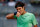 MADRID, SPAIN - MAY 09:  Roger Federer of Switzerland reacts in his match against Kei Nishikori of Japan on day six of the Mutua Madrid Open tennis tournament at the Caja Magica on May 9, 2013 in Madrid, Spain.  (Photo by Gonzalo Arroyo Moreno/Getty Images)