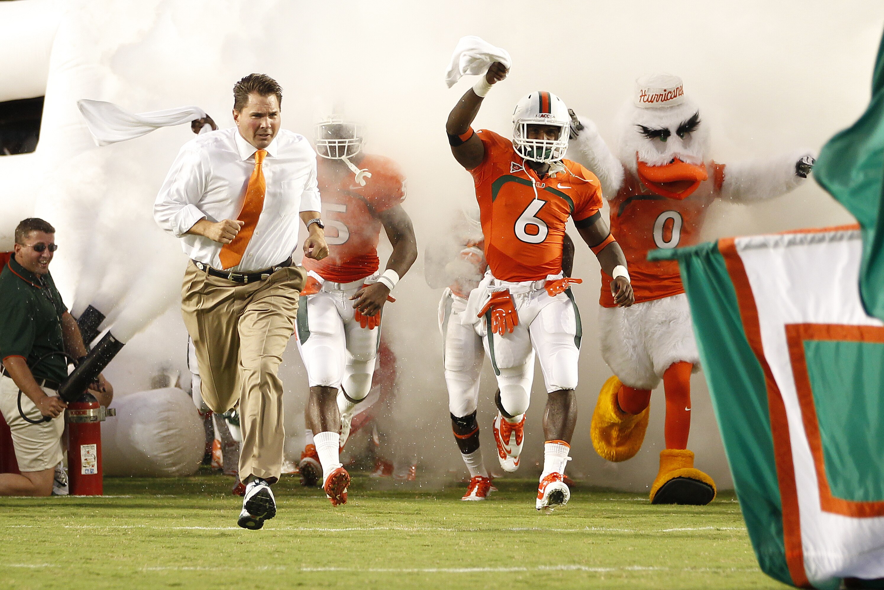 MIAMI, FL - SEPTEMBER 17: Head Coach Al Golden of the Miami Hurricanes leads the team onto the field for his first home game against the Ohio State Buckeyes on September 17, 2011 at Sun Life Stadium in Miami, Florida. The Hurricanes defeated the Buckeyes 24-6. (Photo by Joel Auerbach/Getty Images)