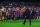 BARCELONA, SPAIN - MAY 19:  Head coach Tito Vilanova walks past his players during the celebration after winning the Spanish League after the La Liga match between FC Barcelona and Real Valladolid CF at Camp Nou on May 19, 2013 in Barcelona, Spain.  (Photo by David Ramos/Getty Images)