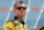 JOLIET, IL - JULY 21:  Jason Leffler, driver of the #18 Dollar General/M&M's Toyota, stands on the grid during qualifying for the NASCAR Camping World Truck Series American Ethanol 225 at Chicagoland Speedway on July 21, 2012 in Joliet, Illinois.  (Photo by Tyler Barrick/Getty Images for NASCAR)