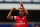 LONDON, ENGLAND - MAY 04:  Theo Walcott of Arsenal acknowledges his sides fans following the Barclays Premier League match between Queens Park Rangers and Arsenal at Loftus Road on May 04, 2013 in London, England.  (Photo by Clive Rose/Getty Images)