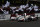 LE MANS, FRANCE - JUNE 17:  The first placed Audi Sport Team Joest R18 E-Tron Quattro of Andre Lotterer, Marcel Fassler and Benoit Treluyer (R) and the second placed The Audi Sport R18 E-Tron Quattro of Allan McNish, Tom Kristensen and Dindo Capello (L) drive past their team mates at the end of the Le Mans 24 Hour race at the Circuit de la Sarthe on June 16, 2012 in Le Mans, France.  (Photo by Ker Robertson/Getty Images)