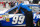 A crew member directs the No. 99 Ford of Carl Edwards to inspection.   Credit: Dwight Drum