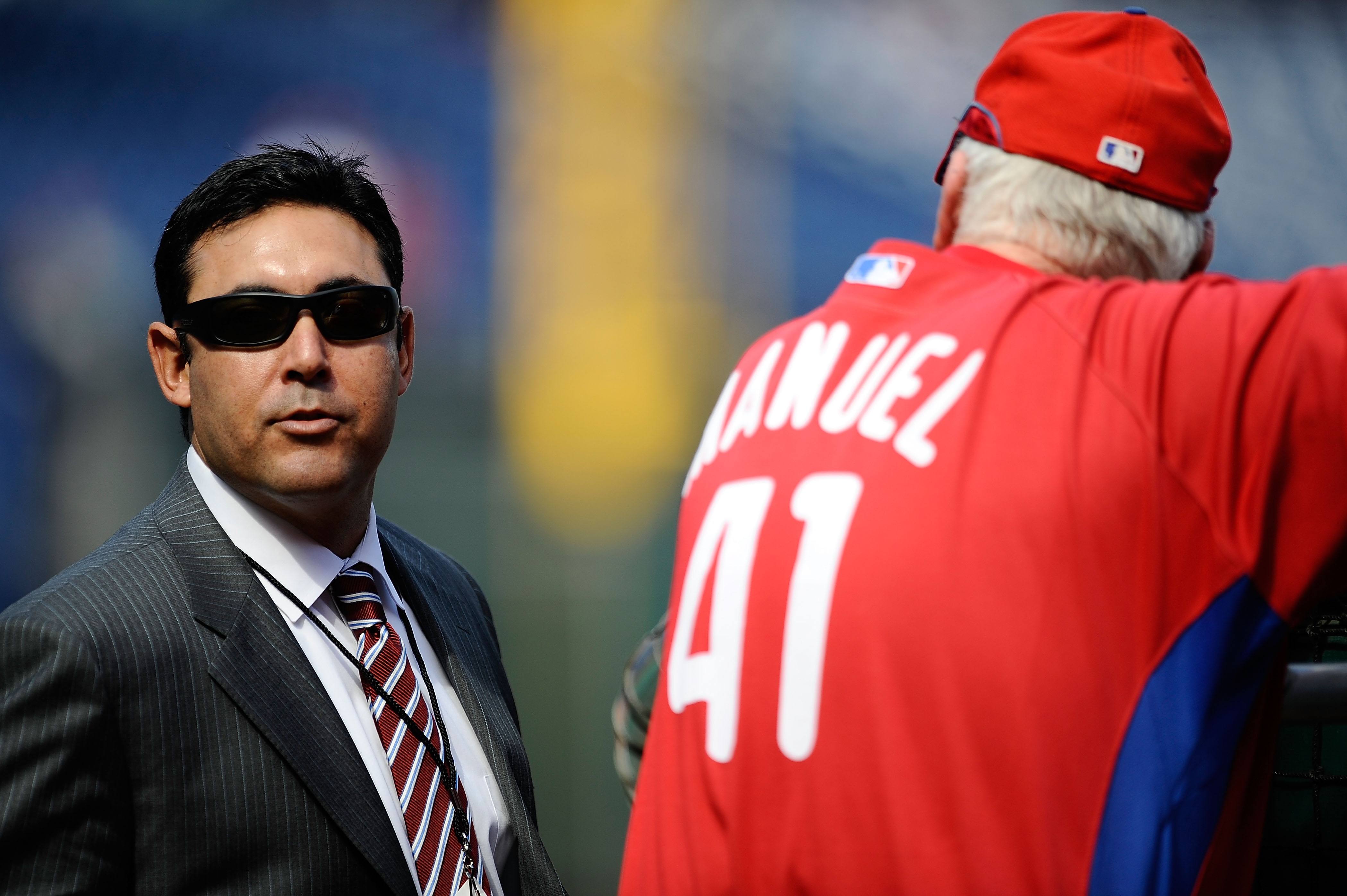 PHILADELPHIA - OCTOBER 08: General Manager Ruben Amaro Jr. of the Philadelphia Phillies talks with Phillies manager Charlie Manuel #41 on the field during batting practice prior to Game Two of the NLDS against the Colorado Rockies during the 2009 MLB Playoffs at Citizens Bank Park on October 8, 2009 in Philadelphia, Pennsylvania. (Photo by Jeff Zelevansky/Getty Images)